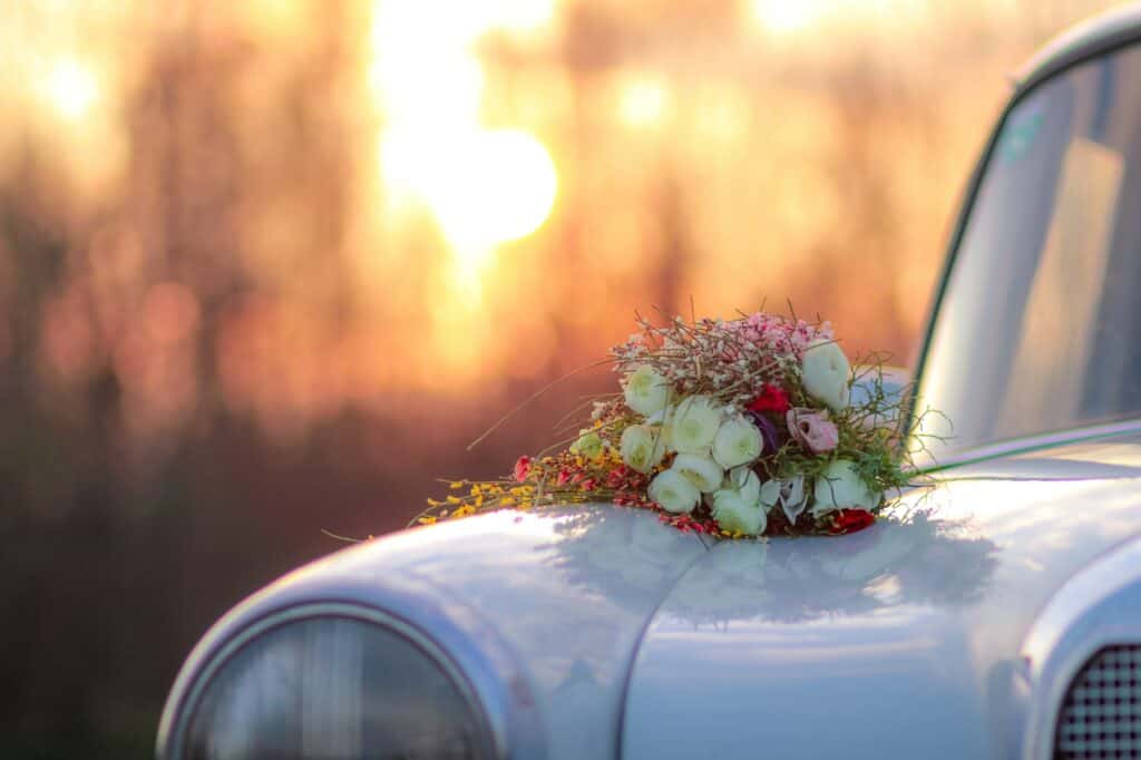 Wedding bouquet and vintage car